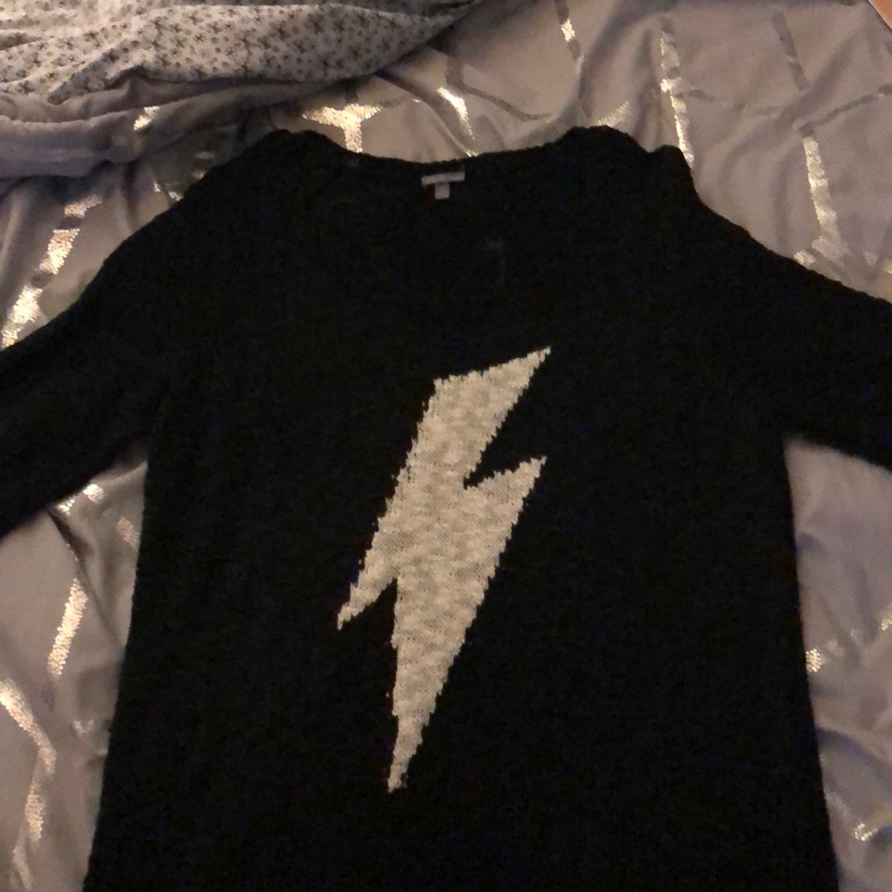 A sweater with a lightning bolt on it